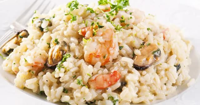 Recette de risotto aux fruits de mer crémeux et savoureux à réaliser facilement Recette de risotto aux fruits de mer crémeux et savoureux à réaliser facilement